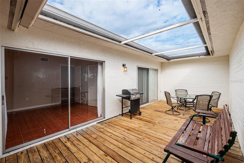 5409 Orange Blossom Road Pinellas Park, FL 33782 - Photo 23 of 30 a bedroom with a bed and a mirror