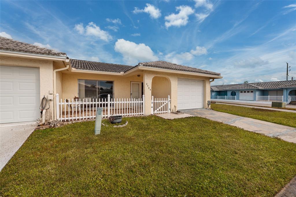 5409 Orange Blossom Road Pinellas Park, FL 33782 - Photo 29 of 30 a front view of a house with a yard