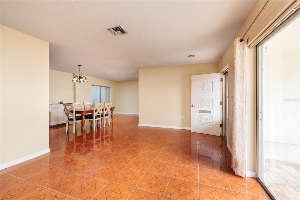 5409 Orange Blossom Road Pinellas Park, FL 33782 - Photo 7 of 30 a view of a livingroom with furniture and a stove top oven