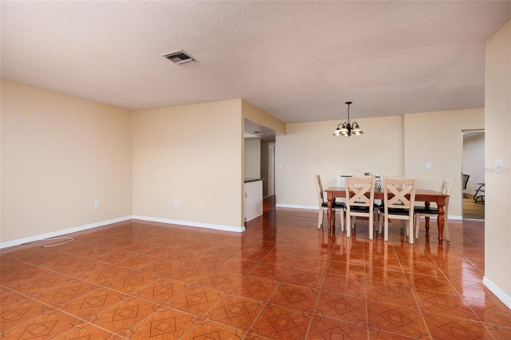 5409 Orange Blossom Road Pinellas Park, FL 33782 - Photo 9 of 30 a view of a dining room with furniture