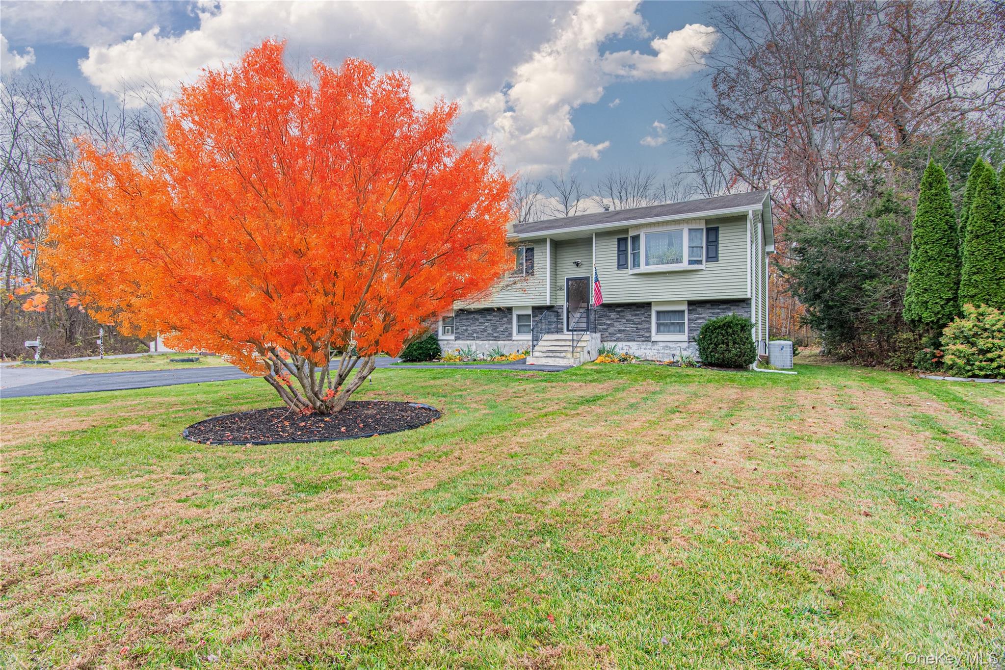 32 Deer Run Road Poughkeepsie, NY 12603 - Photo 1 of 30 a front view of a house with a yard and garage