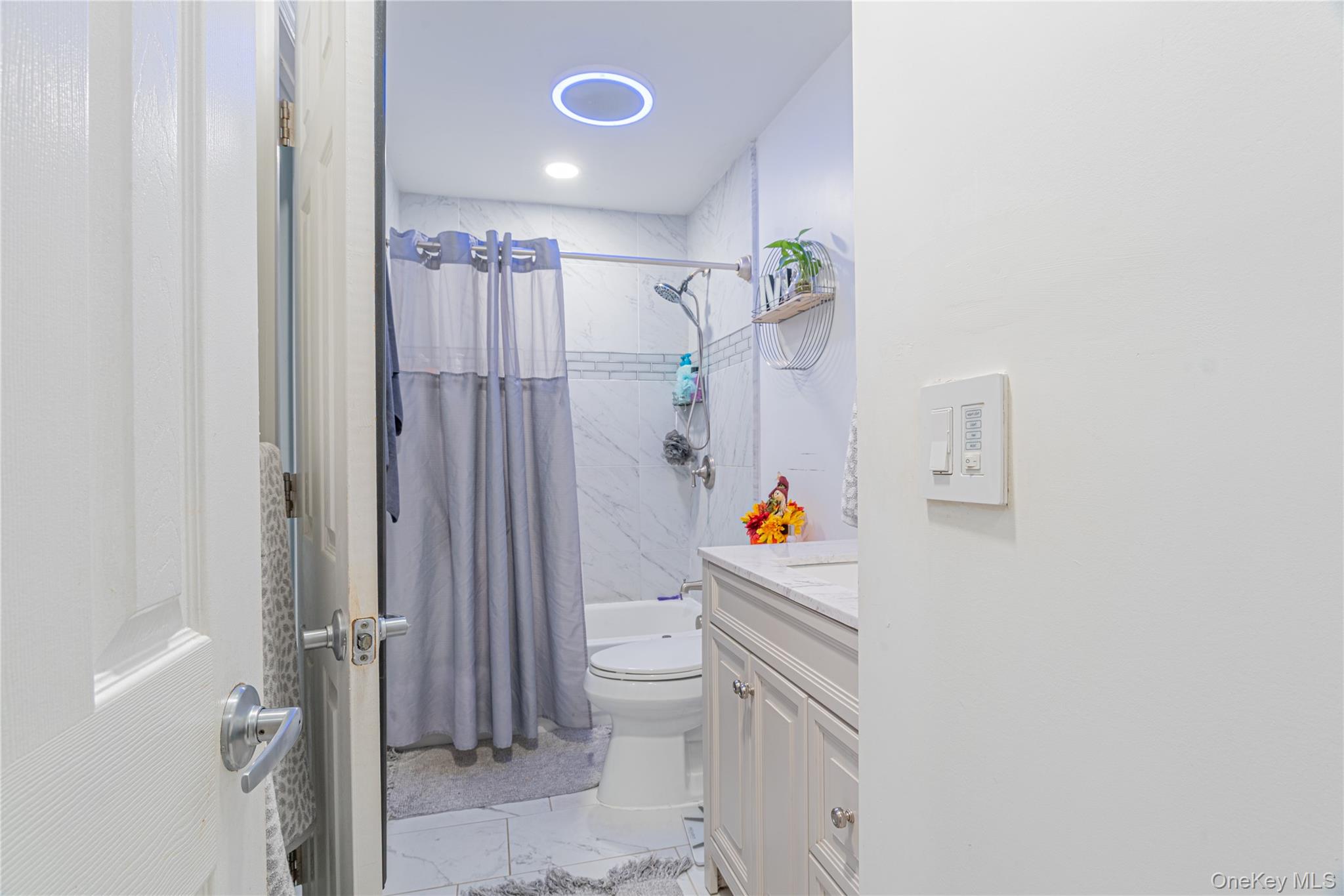 32 Deer Run Road Poughkeepsie, NY 12603 - Photo 17 of 30 a room with a white cabinet and a shower curtain