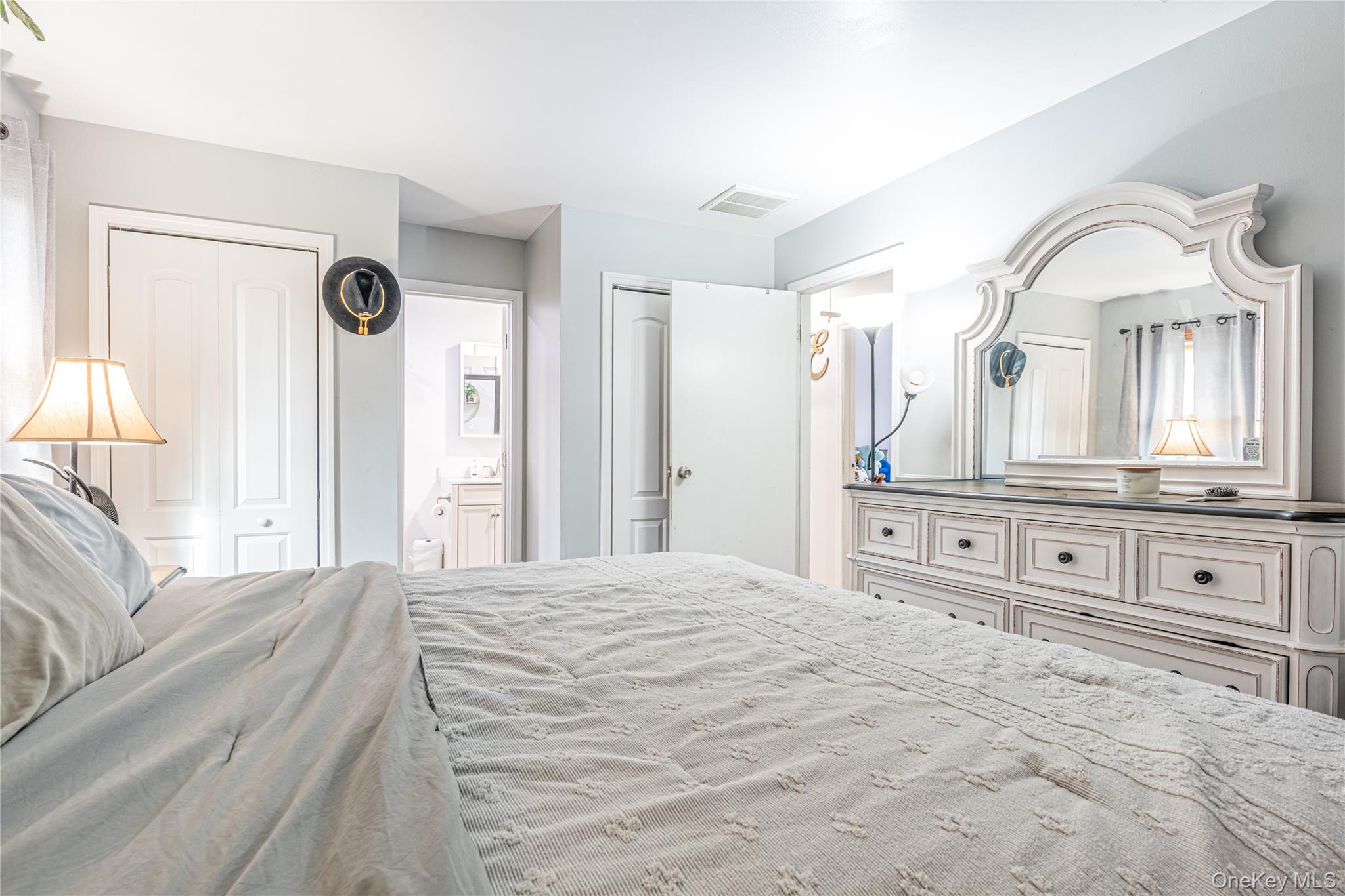 32 Deer Run Road Poughkeepsie, NY 12603 - Photo 20 of 30 a spacious bedroom with a bed a dresser and large mirror