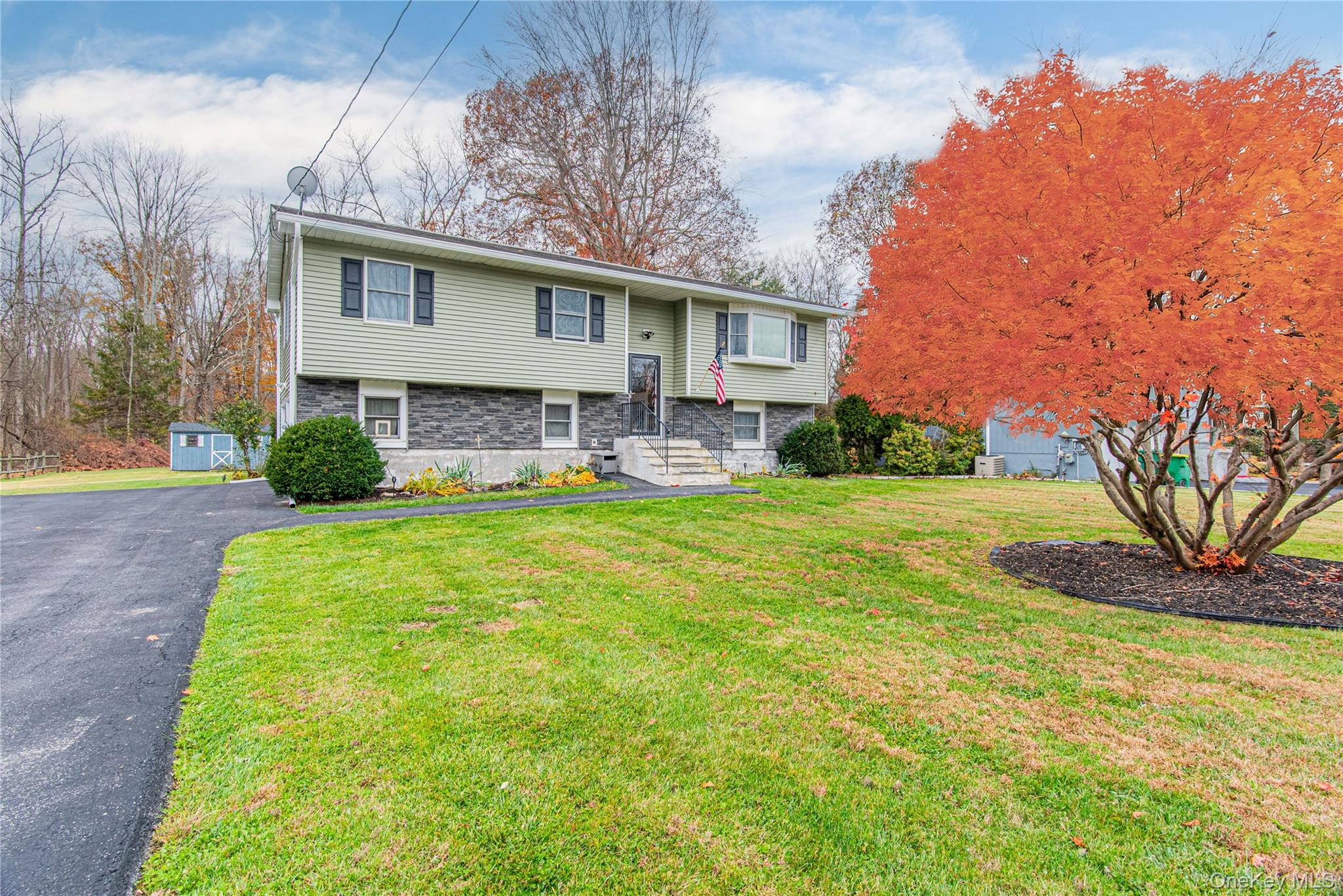 32 Deer Run Road Poughkeepsie, NY 12603 - Photo 2 of 30 a front view of a house with garden