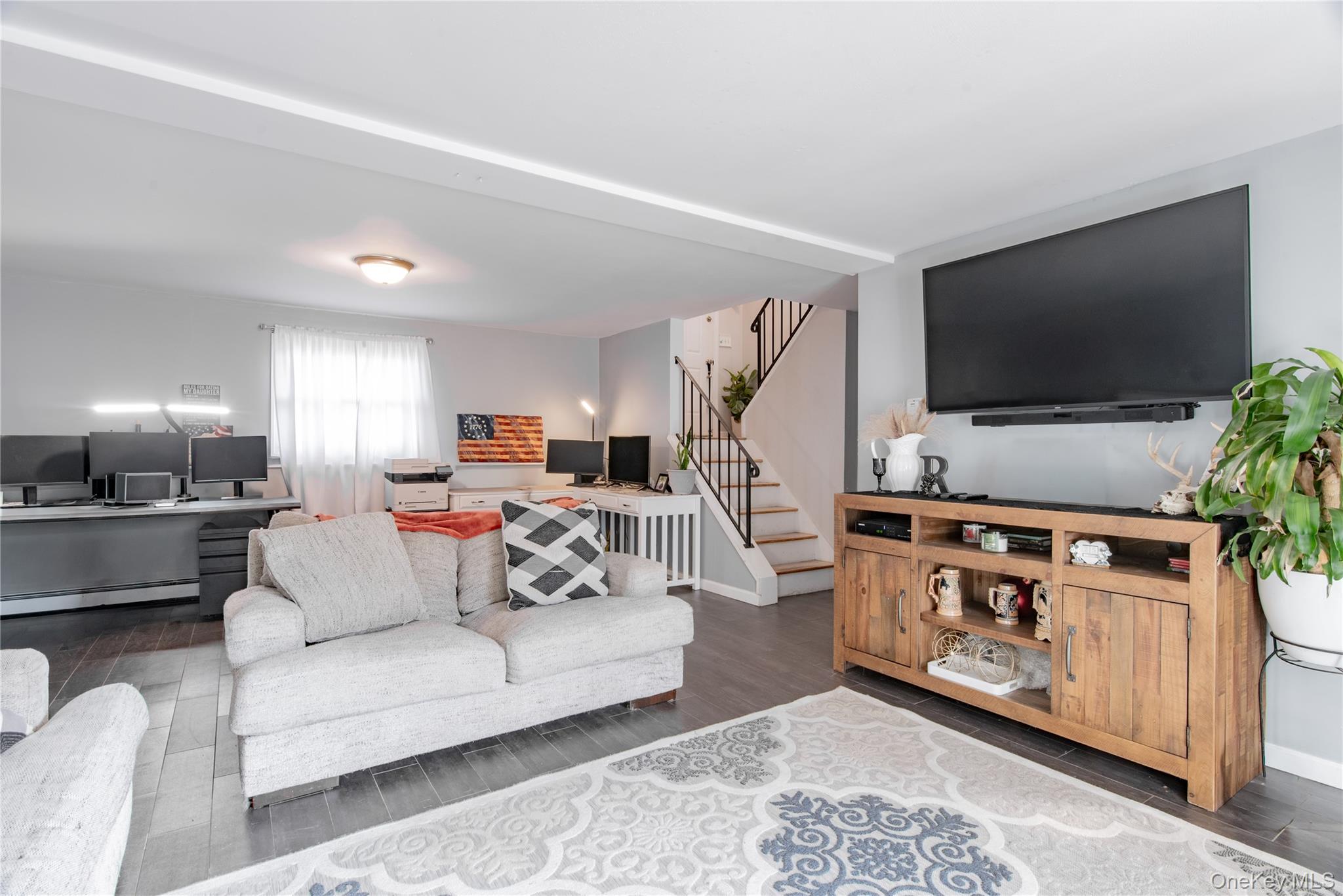32 Deer Run Road Poughkeepsie, NY 12603 - Photo 26 of 30 a living room with furniture and a flat screen tv