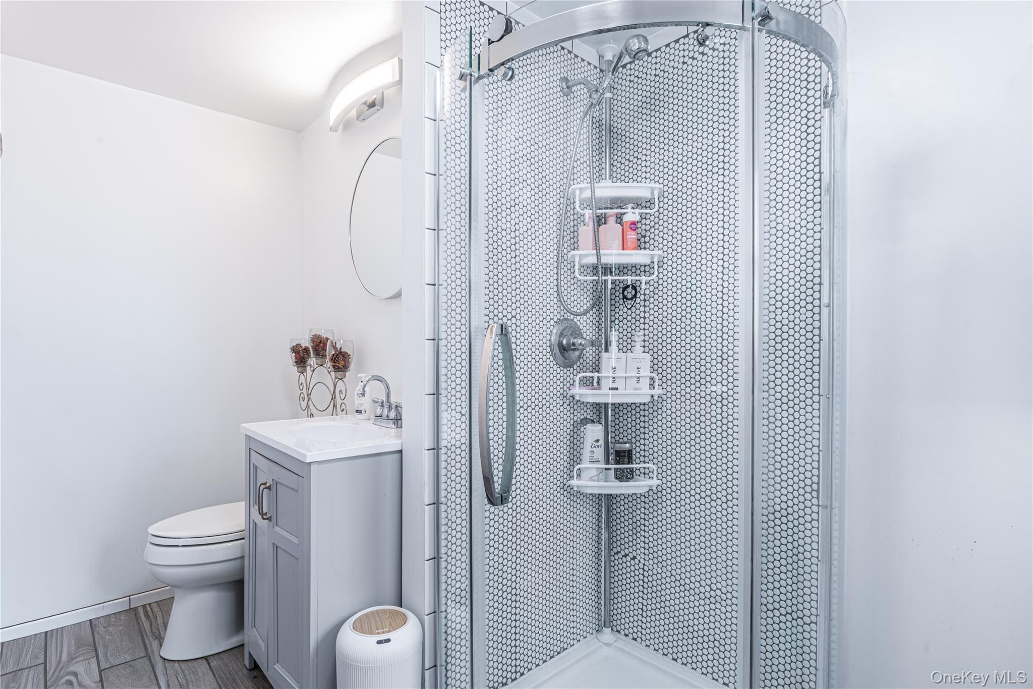 32 Deer Run Road Poughkeepsie, NY 12603 - Photo 28 of 30 a bathroom with a toilet sink and shower