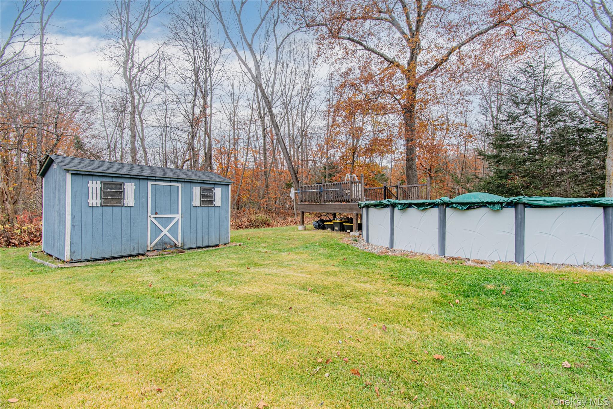 32 Deer Run Road Poughkeepsie, NY 12603 - Photo 6 of 30 a backyard of a house with table and chairs