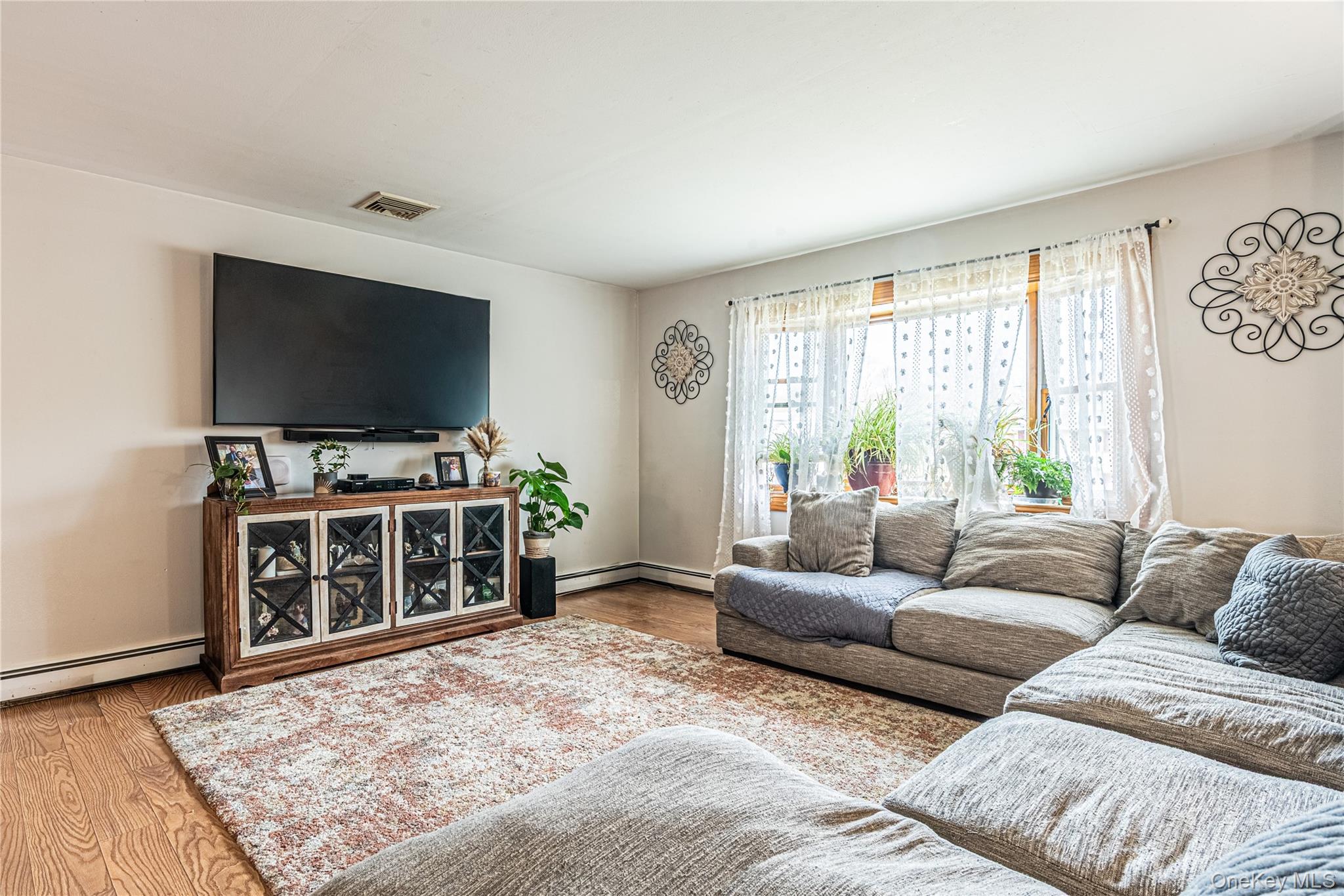 32 Deer Run Road Poughkeepsie, NY 12603 - Photo 10 of 30 a living room with furniture and a flat screen tv