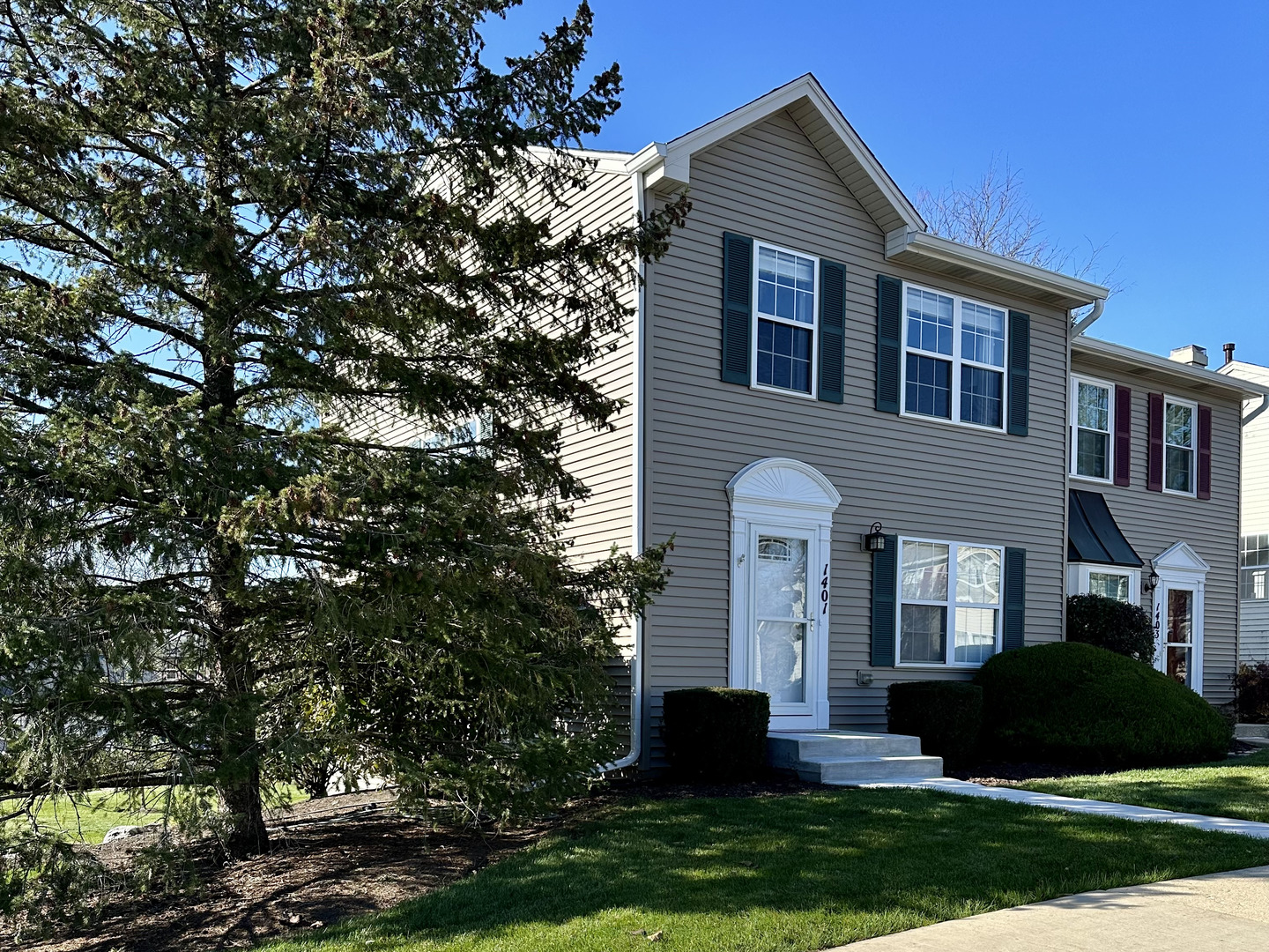 1401 Potomac Court Geneva, IL 60134 - Photo 1 of 18 a front view of a house with a yard