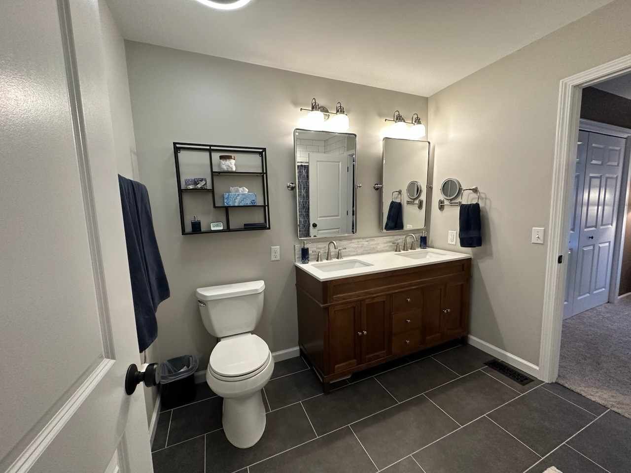 1401 Potomac Court Geneva, IL 60134 - Photo 14 of 18 a bathroom with a toilet a sink and mirror