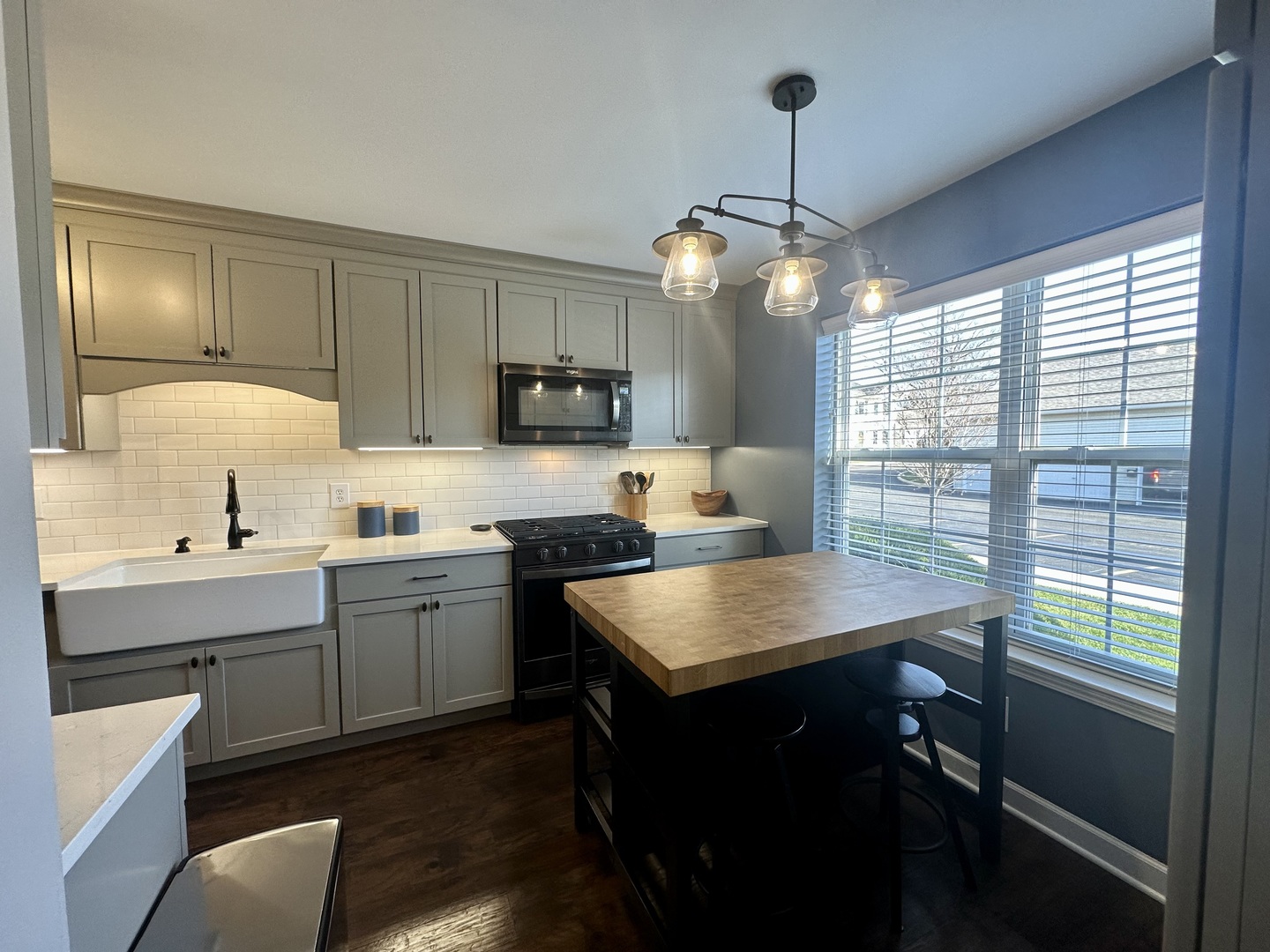 1401 Potomac Court Geneva, IL 60134 - Photo 4 of 18 a kitchen with sink cabinets and window
