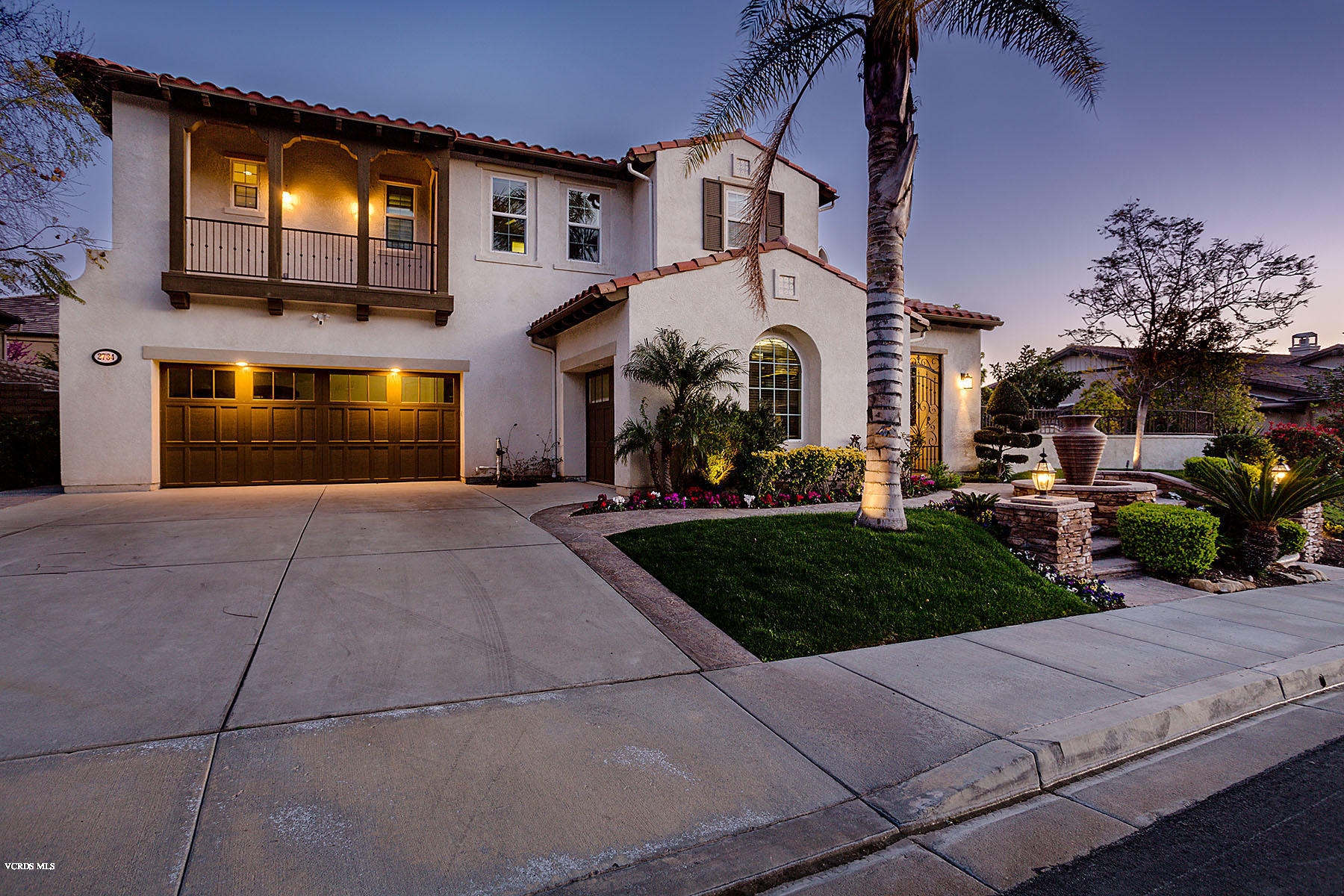 2734 Forest Grove Lane Simi Valley, CA 93065 - Photo 2 of 57 a front view of a house with a yard and garage