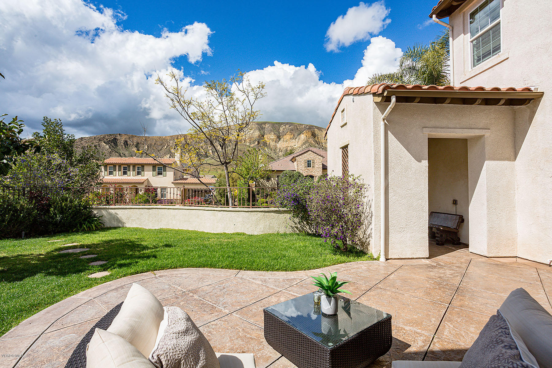 2734 Forest Grove Lane Simi Valley, CA 93065 - Photo 11 of 57 a view of a white house with a yard