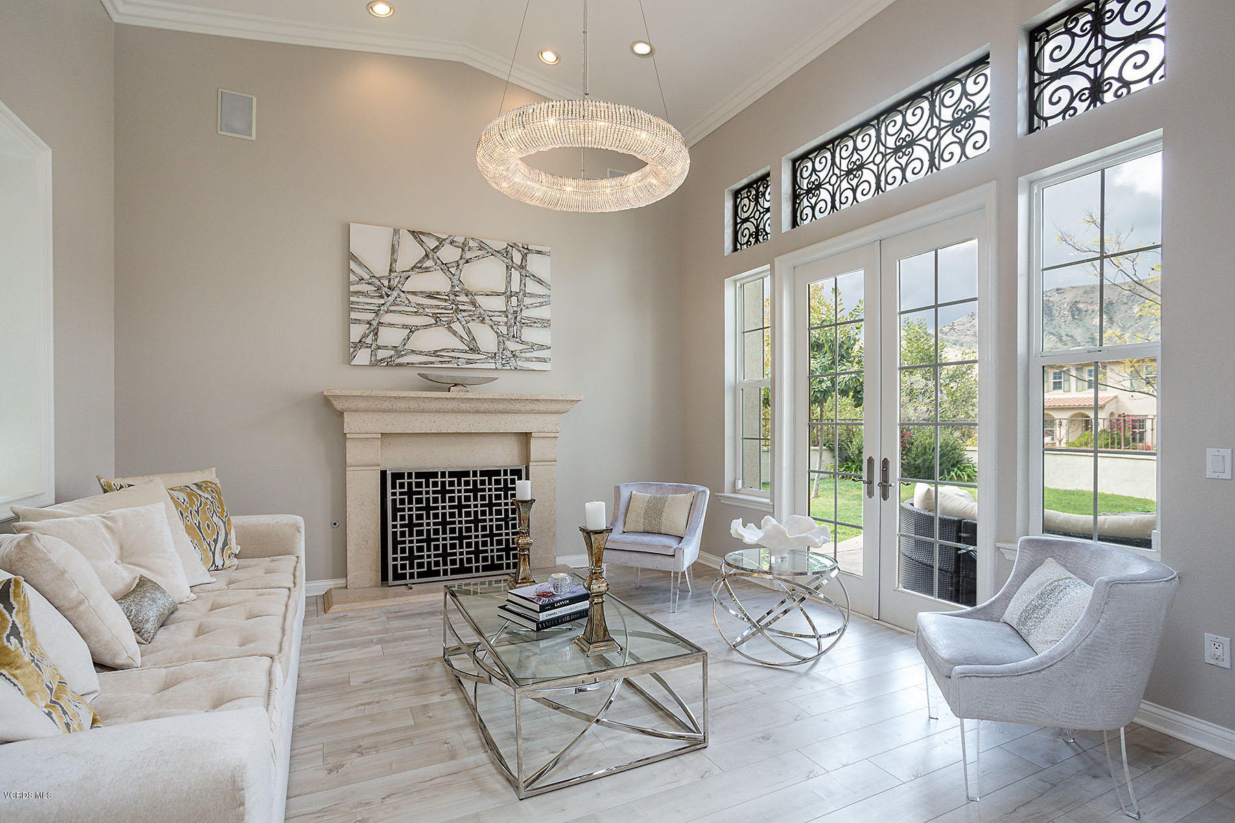2734 Forest Grove Lane Simi Valley, CA 93065 - Photo 13 of 57 a living room with furniture a fireplace and a large mirror
