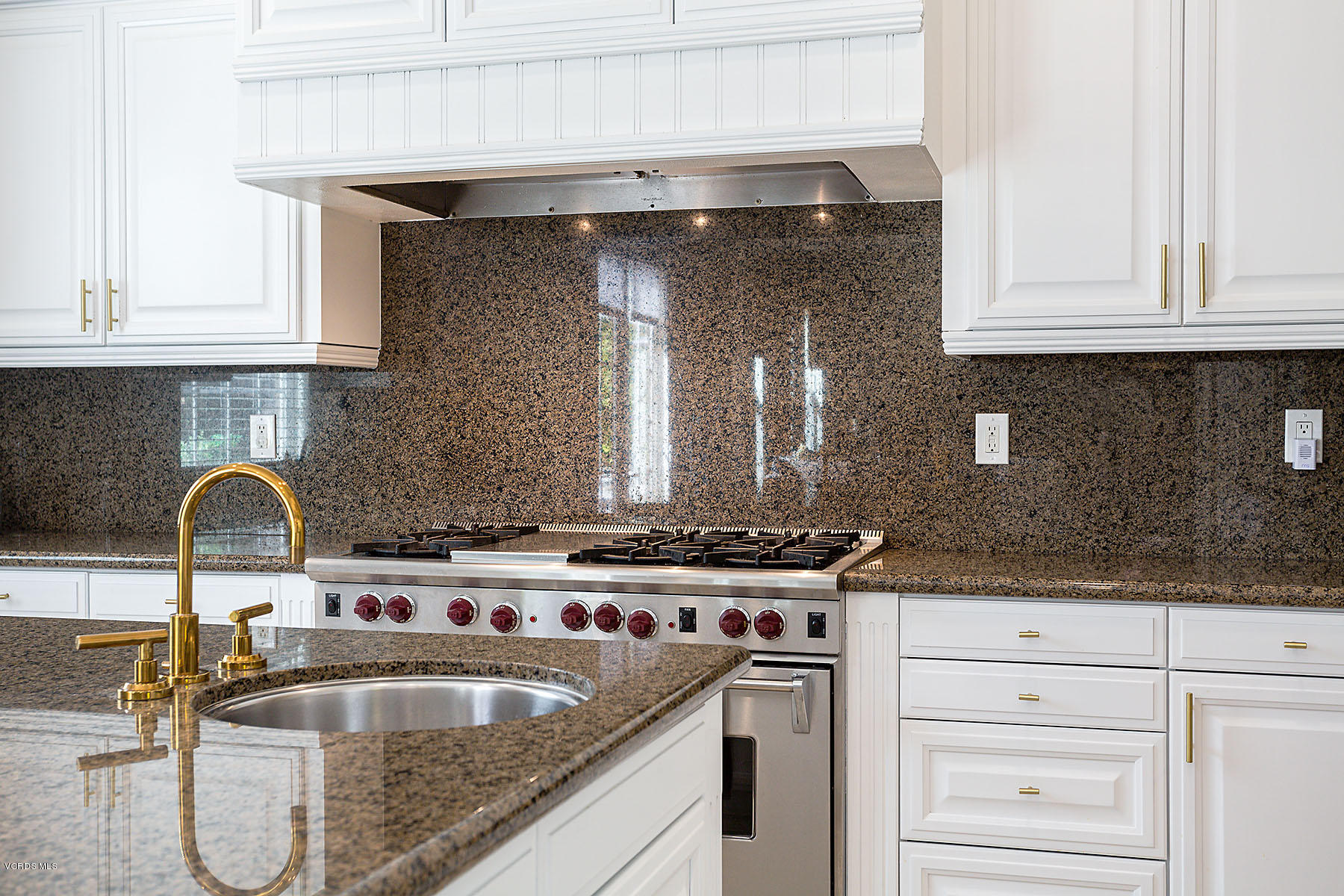 2734 Forest Grove Lane Simi Valley, CA 93065 - Photo 17 of 57 a kitchen with granite countertop a sink a stove and cabinets