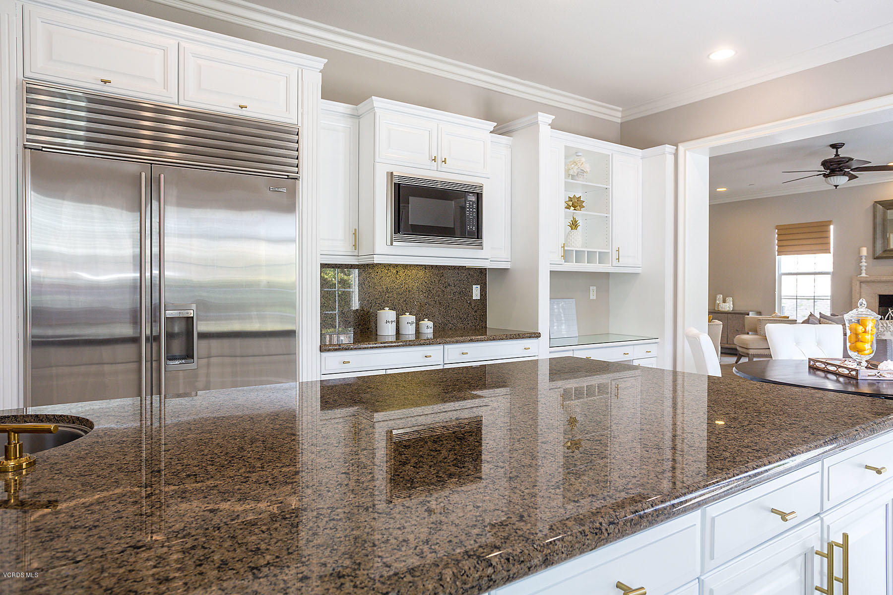 2734 Forest Grove Lane Simi Valley, CA 93065 - Photo 18 of 57 a kitchen with granite countertop a sink and a stove