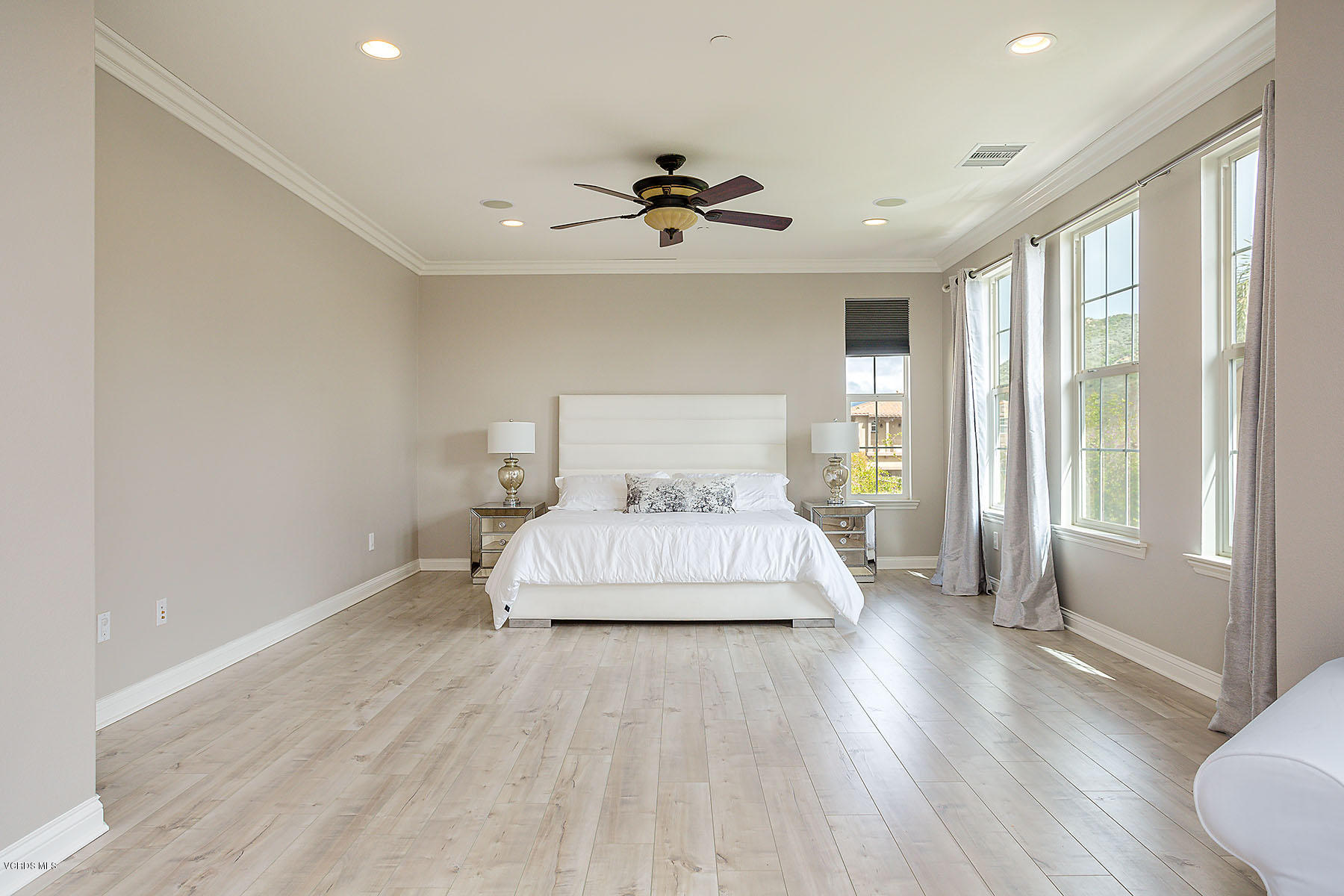 2734 Forest Grove Lane Simi Valley, CA 93065 - Photo 32 of 57 a spacious bedroom with a bed and wooden floor
