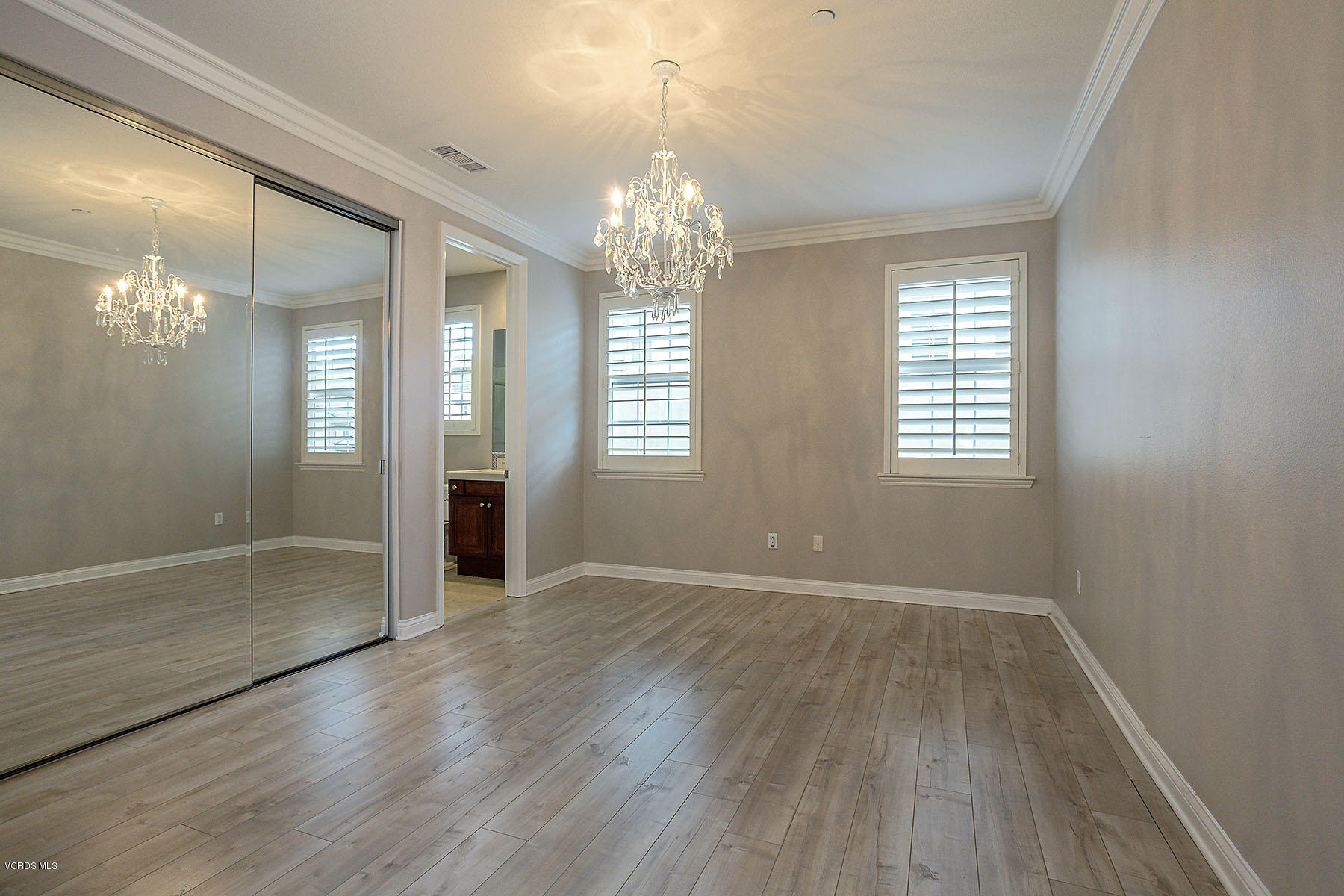 2734 Forest Grove Lane Simi Valley, CA 93065 - Photo 38 of 57 a view of an empty room with wooden floor and a window