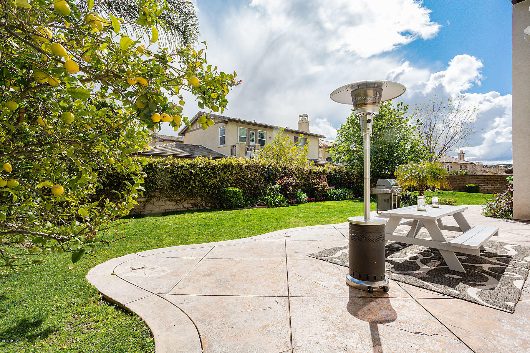 2734 Forest Grove Lane Simi Valley, CA 93065 - Photo 47 of 57 a view of a patio with table and chairs and potted plants