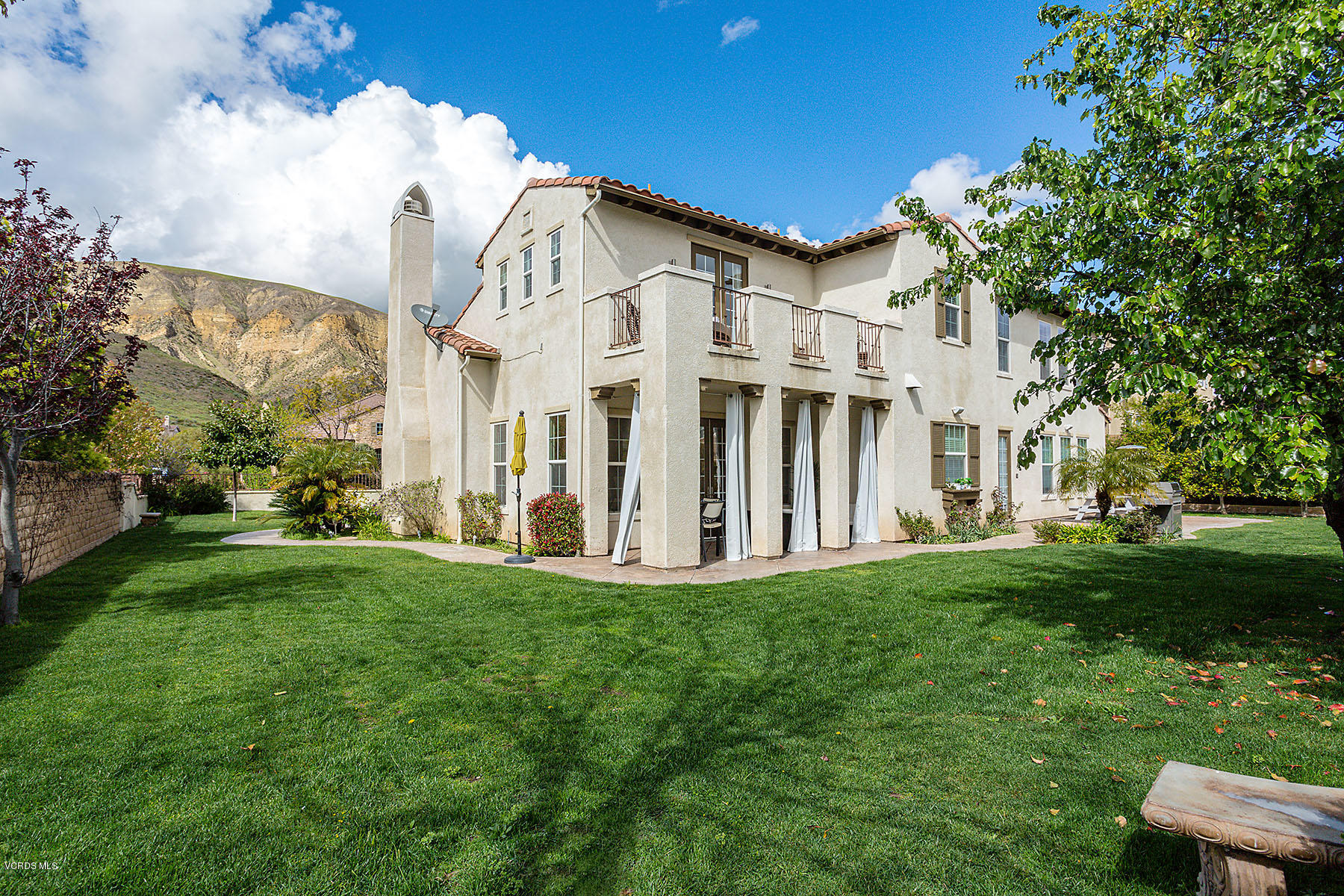 2734 Forest Grove Lane Simi Valley, CA 93065 - Photo 49 of 57 a view of a white house with a big yard and large trees
