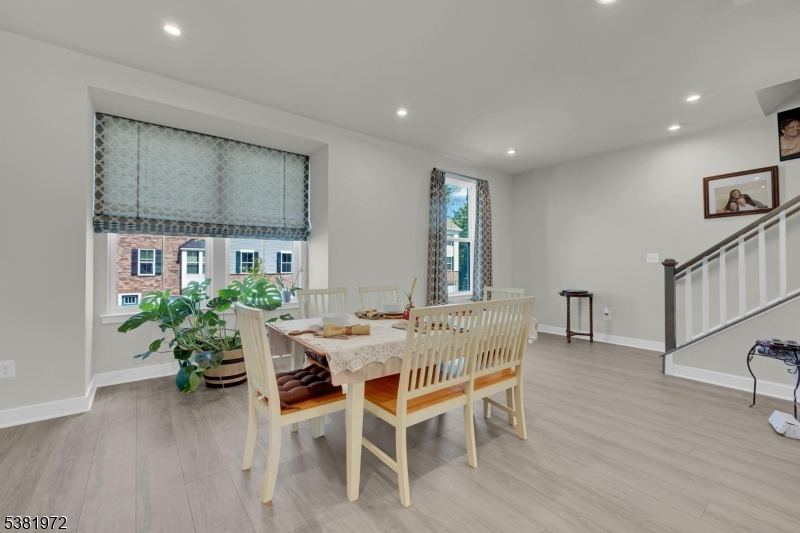 20 Peckwell Street Budd Lake, NJ 07828 - Photo 15 of 39 a dining room with furniture potted plants and wooden floor