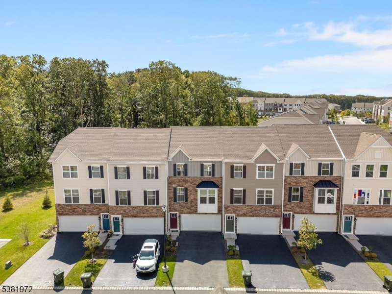20 Peckwell Street Budd Lake, NJ 07828 - Photo 2 of 39 a front view of residential houses with yard and trees