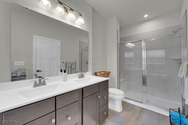 20 Peckwell Street Budd Lake, NJ 07828 - Photo 25 of 39 a bathroom with a sink double vanity and a shower