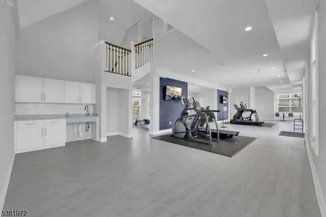 a view of a livingroom with furniture and a flat screen tv