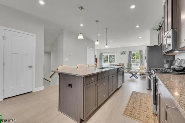 a kitchen with counter top space and sink