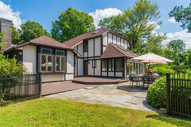a house with swimming pool in front of it