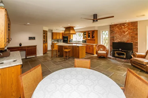 a kitchen with sink refrigerator and stove