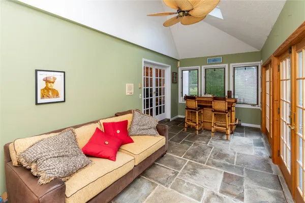 a living room with furniture and a large window