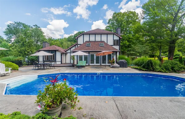 a view of a house with swimming pool