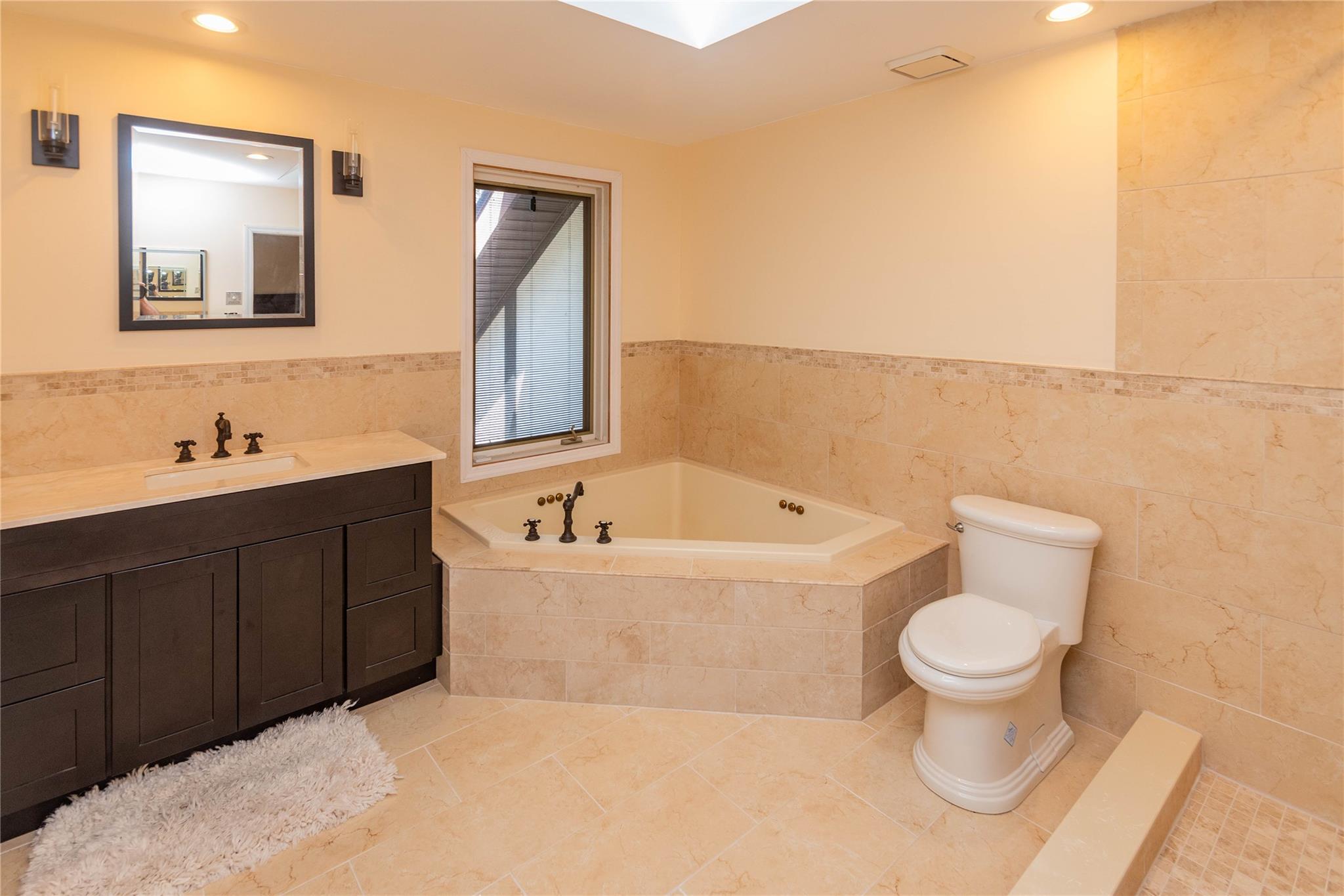 7 Fox Hollow Road Brewster, NY 10509 - Photo 28 of 33 a bathroom with a toilet sink and mirror