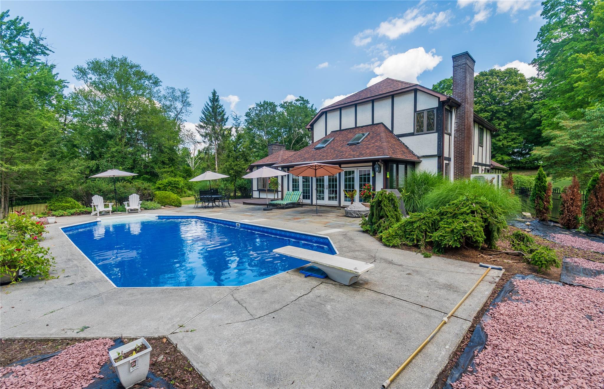 7 Fox Hollow Road Brewster, NY 10509 - Photo 30 of 33 a view of swimming pool with outdoor seating and plants