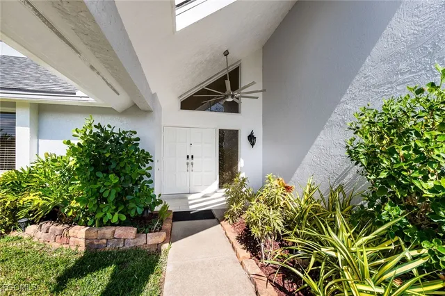a view of a backyard with potted plants
