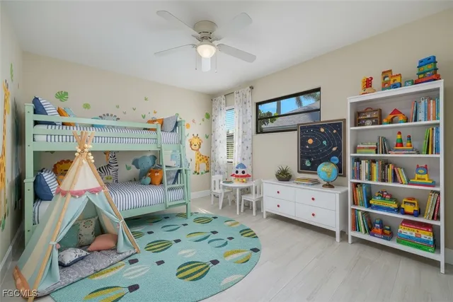a bed room with furniture and a baby crib