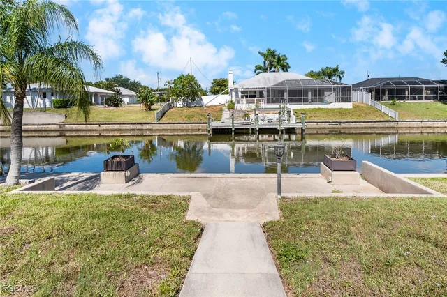 a view of a lake with a table and chairs