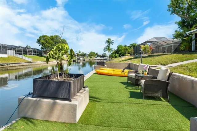 a view of swimming pool with seating space and outdoor view