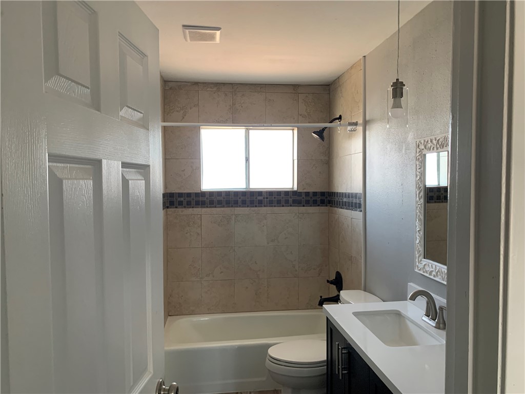 1601 West Manor Drive Corpus Christi, TX 78411 - Photo 17 of 25 a bathroom with a sink toilet and shower