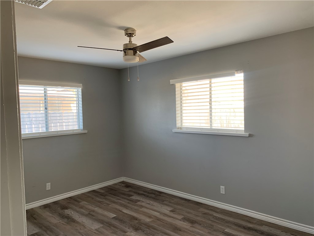 1601 West Manor Drive Corpus Christi, TX 78411 - Photo 20 of 25 an empty room with a window and a fan