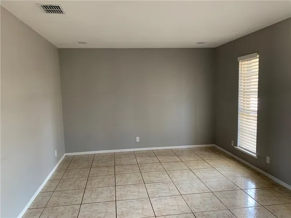 a view of an empty room and window