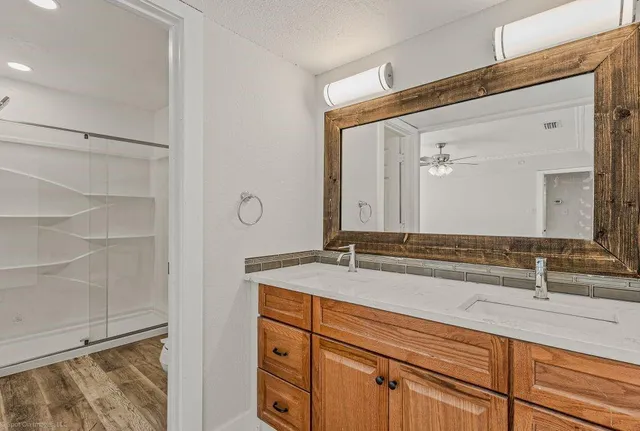 a bathroom with a sink and a mirror