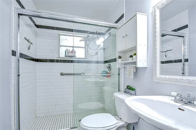 a view of a kitchen area with sink and chairs