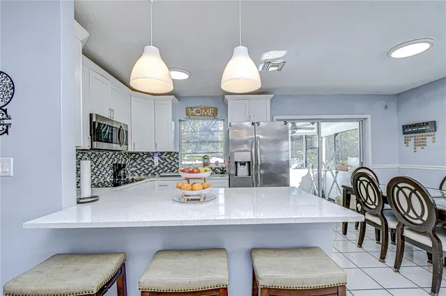 a kitchen with a sink cabinets and window