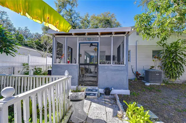 a view of a tree in front of a house