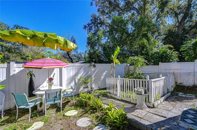 a balcony with furniture and a potted plant