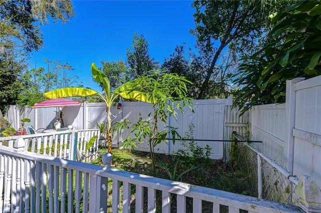a living room with furniture and windows