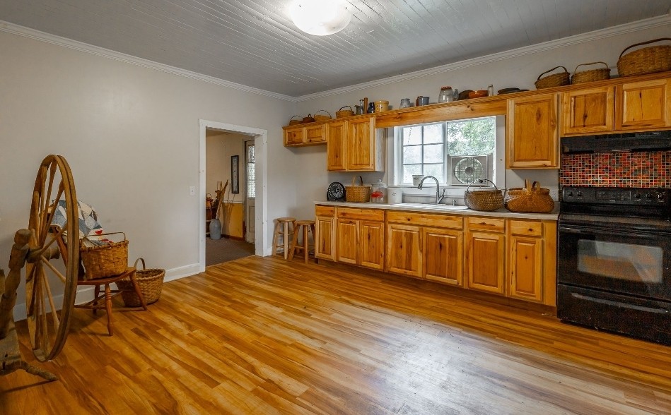 2419 Maple Street Chattanooga, TN 37406 - Photo 20 of 32 a large kitchen with stainless steel appliances a stove a sink dishwasher and a microwave oven with cabinets