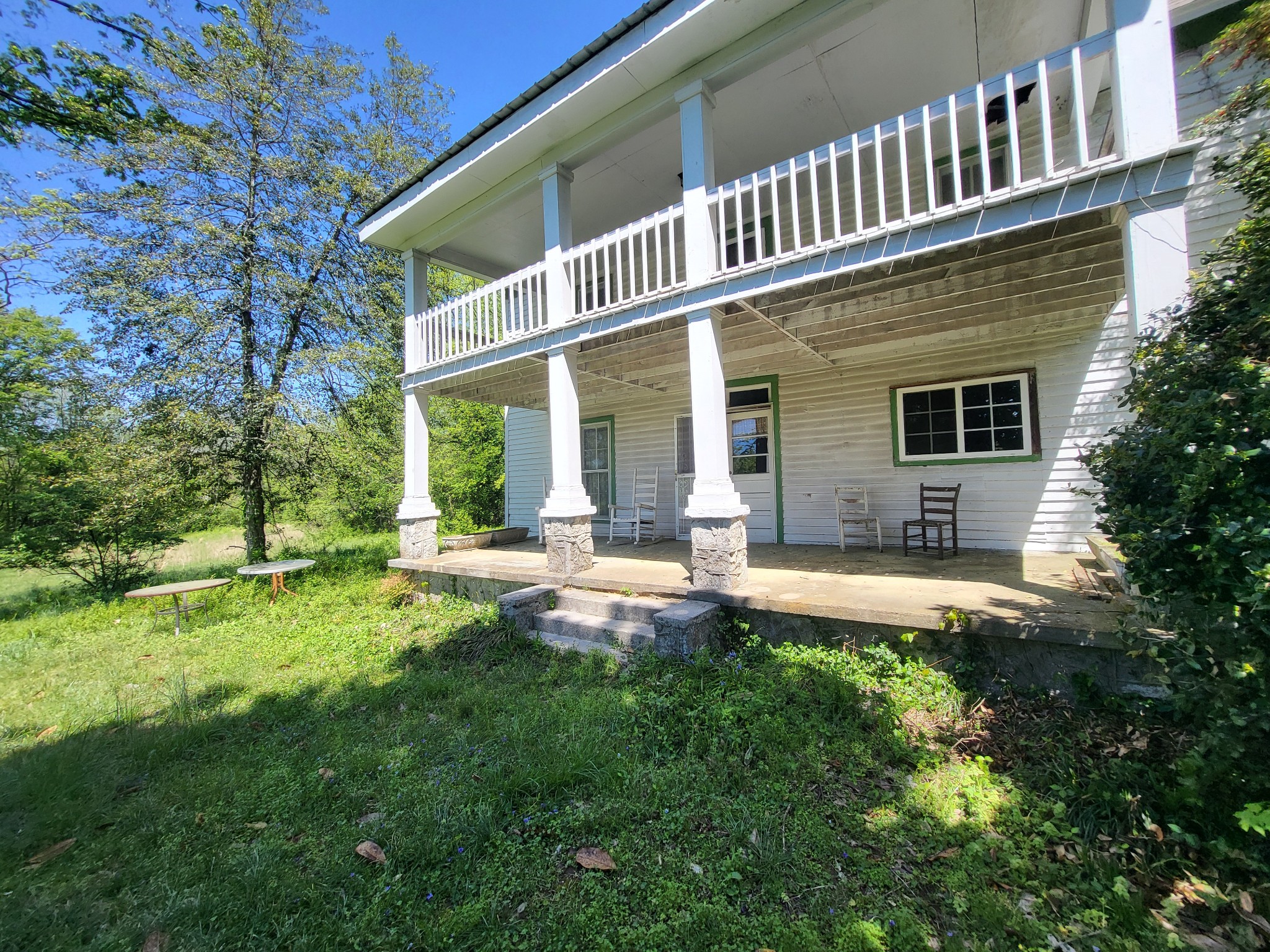 2419 Maple Street Chattanooga, TN 37406 - Photo 4 of 32 a backyard of a house with table and chairs and potted plants